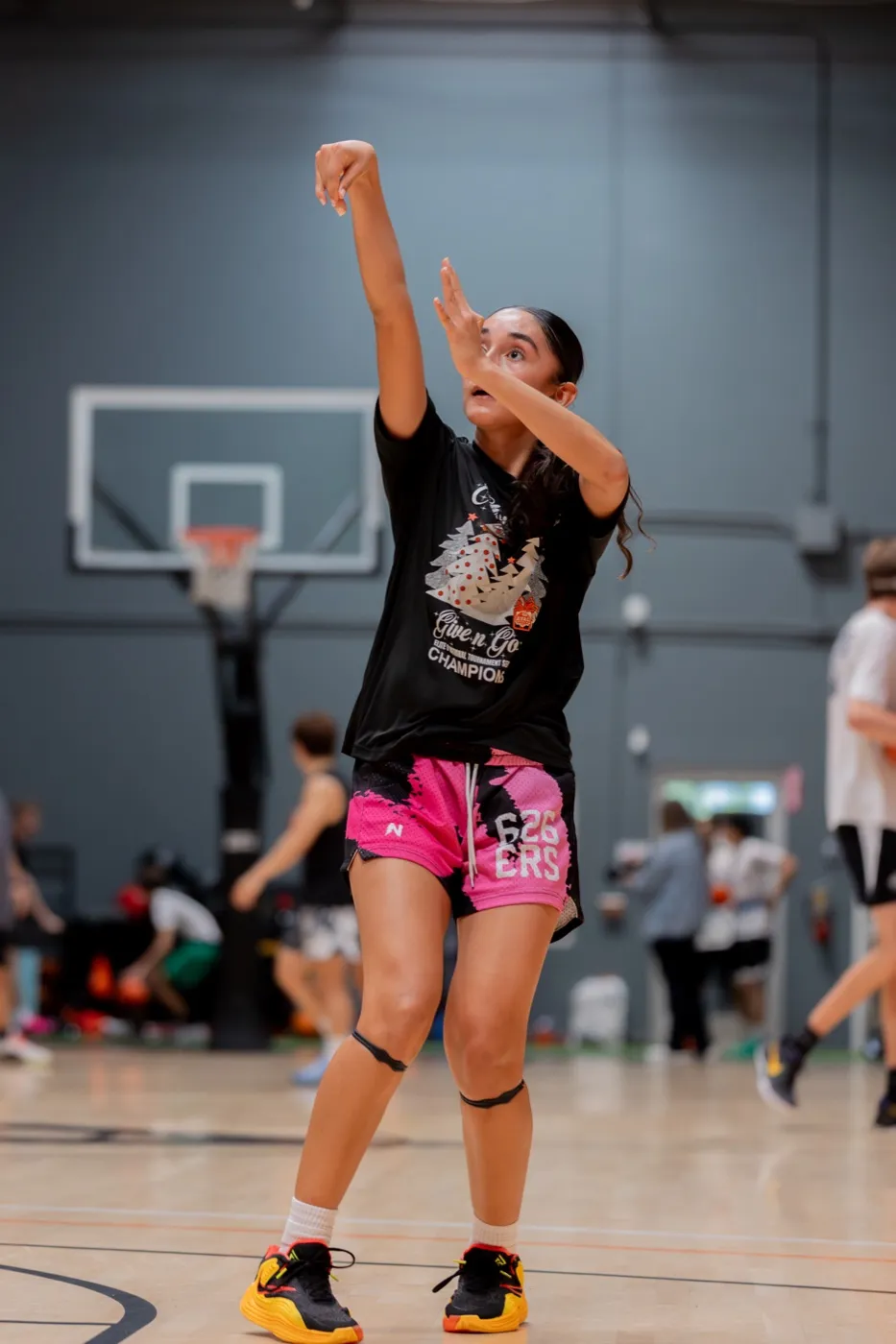 Rising into a pull-up jumper with a full follow-through.