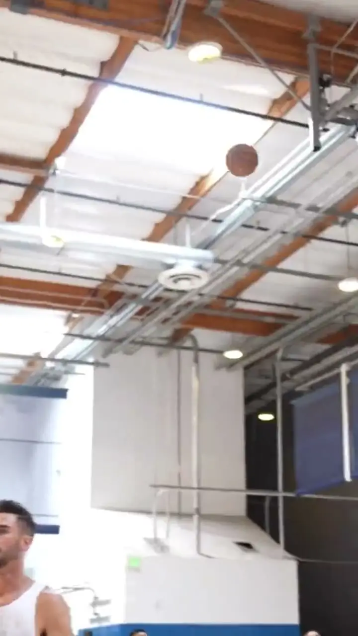 A jump shot in the gym during a pro training session